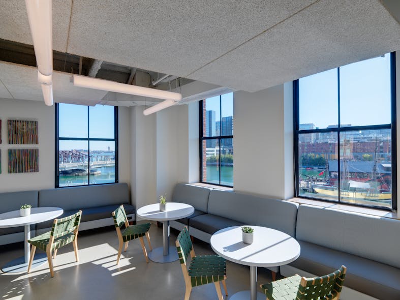 Employees working in the Boston office can get up from their booked desks and have meetings in different spaces. Some of the meeting spaces look out over Boston Harbor, delivering a beautiful water view and supporting employee wellbeing.