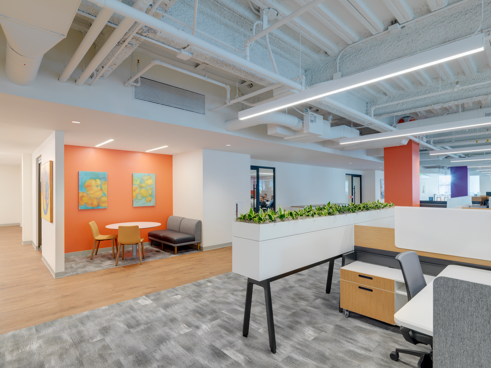 Quickbase&rsquo;s Boston headquarters is packed with nooks and crannies perfect for impromptu meetings. Greenery gives the space a calming feel.