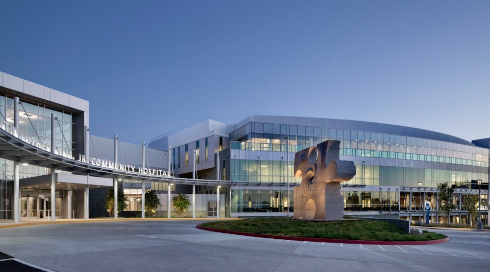 A puzzle piece sculpture sits in the center of the entry port, a symbol of how important the facility is to the fabric of its neighborhood and lips set in behind it represent the voices of those that kept it alive.