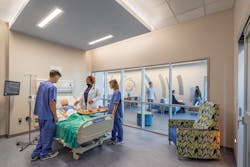 Evoking real-world clinical settings, this class is for nursing simulation. Students are filmed and then regroup to an adjacent video conference room for review. Evoking real-world clinical settings, this class is for nursing simulation. Students are filmed and then regroup to an adjacent video conference room for review.