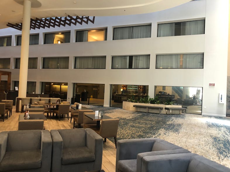 The difference between windows with and without test film applied is stark. The hotel ultimately opted for an interior film with dual properties; the side facing the interior of the room has 5% transparency that guests can see through, while the mirrored side faces the atrium and is difficult to see past.