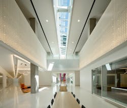 The design team placed the circulation and public rooms in the center of the building and created blocks of utility spaces extending out, such as a long, central bar of conference rooms broken up by open workspaces to help break down the scale. The design team placed the circulation and public rooms in the center of the building and created blocks of utility spaces extending out, such as a long, central bar of conference rooms broken up by open workspaces to help break down the scale.