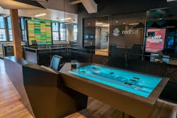 Reception at the Red Hat Executive Briefing Center in Boston centers around an embedded Multitaction table that allows for a seamless badging experience upon entry. Guests and visitors can be scheduled ahead of time or on the fly.