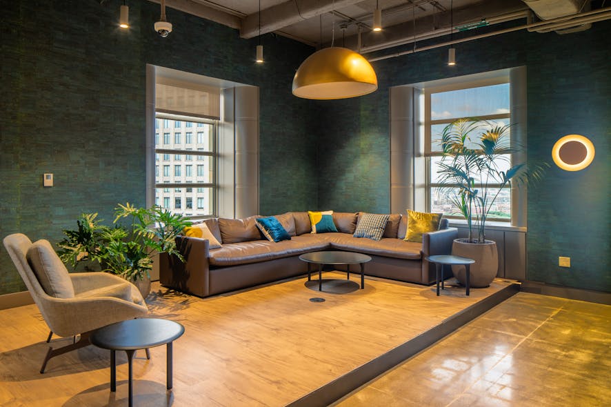 As this corner lounge in the cafeteria for employees with Manulife in Boston demonstrates, a successful amenities program can capitalize on great views with something as simple as a selection of furniture that supports differing work styles, approaches to downtime, and informal meeting structures.
