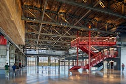 The main staircase is illuminated from top to bottom and acts as a centerpiece for the large floorplate. The main staircase is illuminated from top to bottom and acts as a centerpiece for the large floorplate.