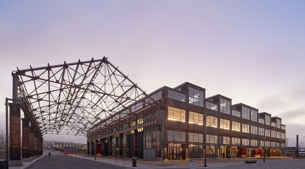 The 230,000-square-foot facility welcomes visitors to the grand market hall via three colossal, red portals and fully operable window walls along key facades to provide maximum porosity between the interior market hall and the surrounding pedestrian plazas and streets.