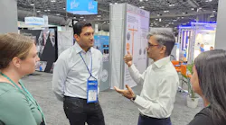 Mahesh Ramanujam, CEO of the Global Network for Zero, discusses the organization on the expo floor at the 2023 BOMA International Conference & Expo. Ramanujam is the former CEO of the U.S. Green Building Council.