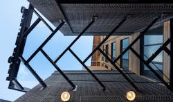 The herringbone rowing pattern is on display in the entryway design. The design inspiration for Aegis Living was the book The Boys in the Boat. The herringbone rowing pattern is on display in the entryway design. The design inspiration for Aegis Living was the book The Boys in the Boat.