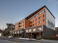 Aegis Living is a 73,000-square-foot assisted living community in Seattle, Washington. The electrified building features the rowing history of the area through imagery and integrated designs.