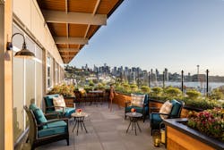 Outdoor community spaces at Aegis Living offer tenants views of the Seattle skyline, including the iconic Space Needle.