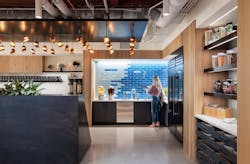 A custom ceiling element allows for plug and play installation of the recycled cardboard pendant lights in three rooms throughout the Twitter office.
