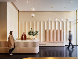 Atelier Cho Thompson transformed the entry desk from a security station stuffed with monitors, cords and redundant equipment into a sleek, minimal reception desk with warm colors and rounded corners to create a sense of welcome.