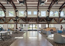Eastern (main) entrance. Larger glazed doors and replacement of patterned translucent glass with low-E treated clear glass in original steel window frames brightens the space. Eastern (main) entrance. Larger glazed doors and replacement of patterned translucent glass with low-E treated clear glass in original steel window frames brightens the space.