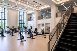 A double-height fitness center is housed in what was originally The Belden-Stratford&rsquo;s ballroom when it first opened as a hotel.