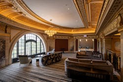 A mezzanine-level resident lounge features an original arched picture window overlooking the Lincoln Park Conservatory. A mezzanine-level resident lounge features an original arched picture window overlooking the Lincoln Park Conservatory.