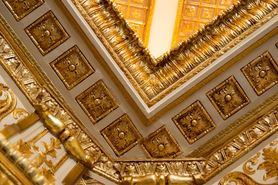Decisions to refurbish craftsmanship, such as gilded plaster molding with gold-leaf detailing in the double-height lobby ceiling, was important to the owner&rsquo;s vision for respecting the building&rsquo;s historic significance.