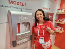 Jen Lyttle, vice president of sales for Aunt Flow, demonstrates the company’s free-vend dispensers. Jen Lyttle, vice president of sales for Aunt Flow, demonstrates the company’s free-vend dispensers.