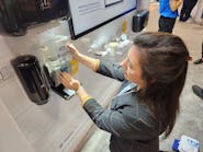 Rachel Olsavicky, Tork&rsquo;s segment marketing manager for commercial and public interest, demonstrates how easy it is to refill the company&rsquo;s counter-mount soap system.
