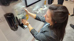 Rachel Olsavicky, Tork’s segment marketing manager for commercial and public interest, demonstrates how easy it is to refill the company’s counter-mount soap system.