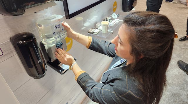 Rachel Olsavicky, Tork&rsquo;s segment marketing manager for commercial and public interest, demonstrates how easy it is to refill the company&rsquo;s counter-mount soap system.