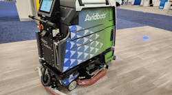 Neo 2, a floor scrubber by AvidBots, cleans the floor at the 2023 ISSA Show North America.