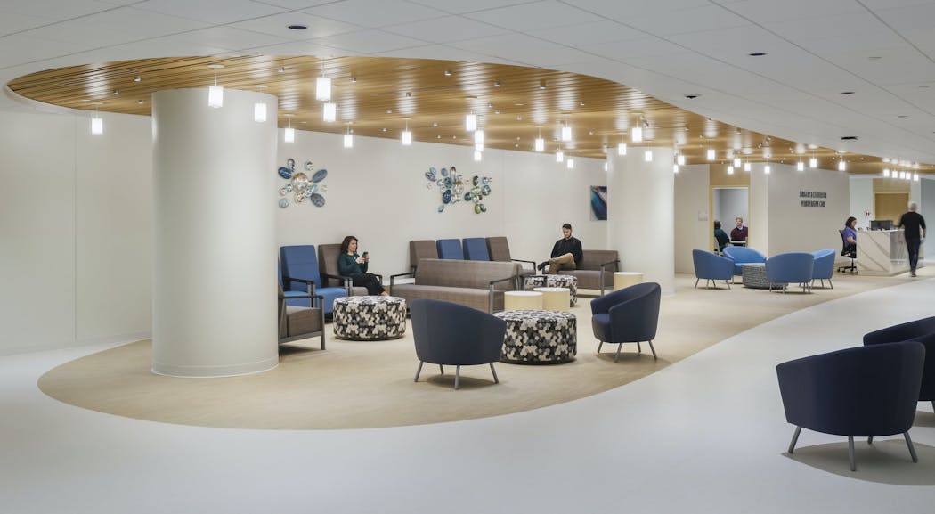 Creating a warm, comfortable environment for the UC Health Emergency Department lobby in Cincinnati, CannonDesign specified lighting in the shape of paper lanterns, expressing joy, good fortune and longevity, and warm neutral colors were selected for the furniture and artwork.