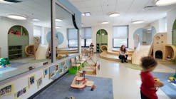 A multi-level fort at the far end of the classroom creates a destination for toddlers to discover as they make their way through the room.