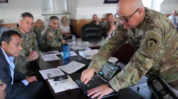 Chief Warrant Officer 5 Andrew Foreman, U.S. Army Europe and Africa G6 Chief Technology Officer, demonstrates LiFi technology as part of the 2d Theater Signal Brigade's LiFi exhibition event Aug. 11, 2021 at USAG Wiesbaden.