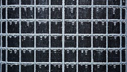 An air conditioner vent on a commercial building. An air conditioner vent on a commercial building.