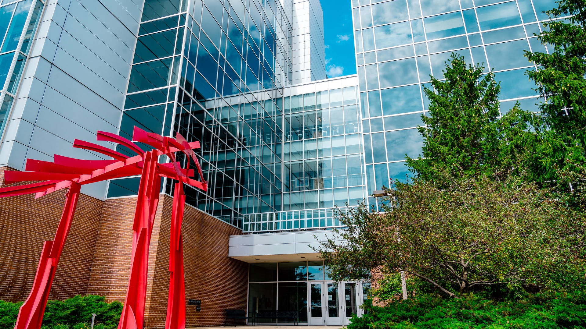 Installation of Ubiquitous Energy's UE Power coating on a Michigan State University building, conducted prior to the announcement of the collaboration between Ubiquitous Energy and Andersen Corp.