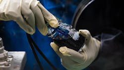 Researchers prepare an experimental flow battery electrolyte that has shown long life in the laboratory setting. Researchers prepare an experimental flow battery electrolyte that has shown long life in the laboratory setting.