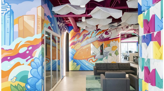 A multi-wall mural, hanging acoustic baffles and colorful, three-dimensional walls greet employees, clients and visitors at Method Architecture’s new offices in Houston.
