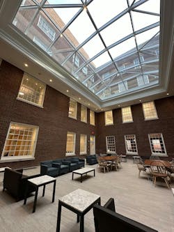 Skanska designed courtyards with upgraded foundations and two 50,000-pound, steel-framed glass-sloped glazing skylights between the 1930s and 1950s buildings. The space reimaged formerly industrial areas into usable study space.