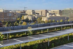 Solar panels are installed on the green roof and the front-facing side of 55 H St. NW, with a rainwater capture system to water the south green roof plants. These are visible sustainable elements on the LEED Platinum building.