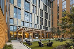 The outdoor courtyard at 55 H St. NW can be seen by passersby from H St. Lounge chairs and electric grills create spaces for residents to interact. The outdoor courtyard at 55 H St. NW can be seen by passersby from H St. Lounge chairs and electric grills create spaces for residents to interact.