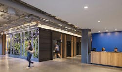 One of the lobby’s main features is a green wall adorned with living plants designed by Elkus Manfredi Architects. One of the lobby’s main features is a green wall adorned with living plants designed by Elkus Manfredi Architects.