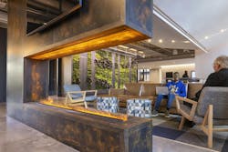 This electric water vapor fireplace serves as the hearth of the parlor space. It offers a safe, energy-efficient and eye-catching feature without introducing a fossil fuel fireplace into the building. This electric water vapor fireplace serves as the hearth of the parlor space. It offers a safe, energy-efficient and eye-catching feature without introducing a fossil fuel fireplace into the building.