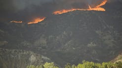 Wildfires burn near Los Angeles, causing heavy smoke.