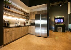 A former lab was removed and the space was reactivated into a galley-style break area featuring a “Rick and Morty” themed arcade machine. A former lab was removed and the space was reactivated into a galley-style break area featuring a “Rick and Morty” themed arcade machine.