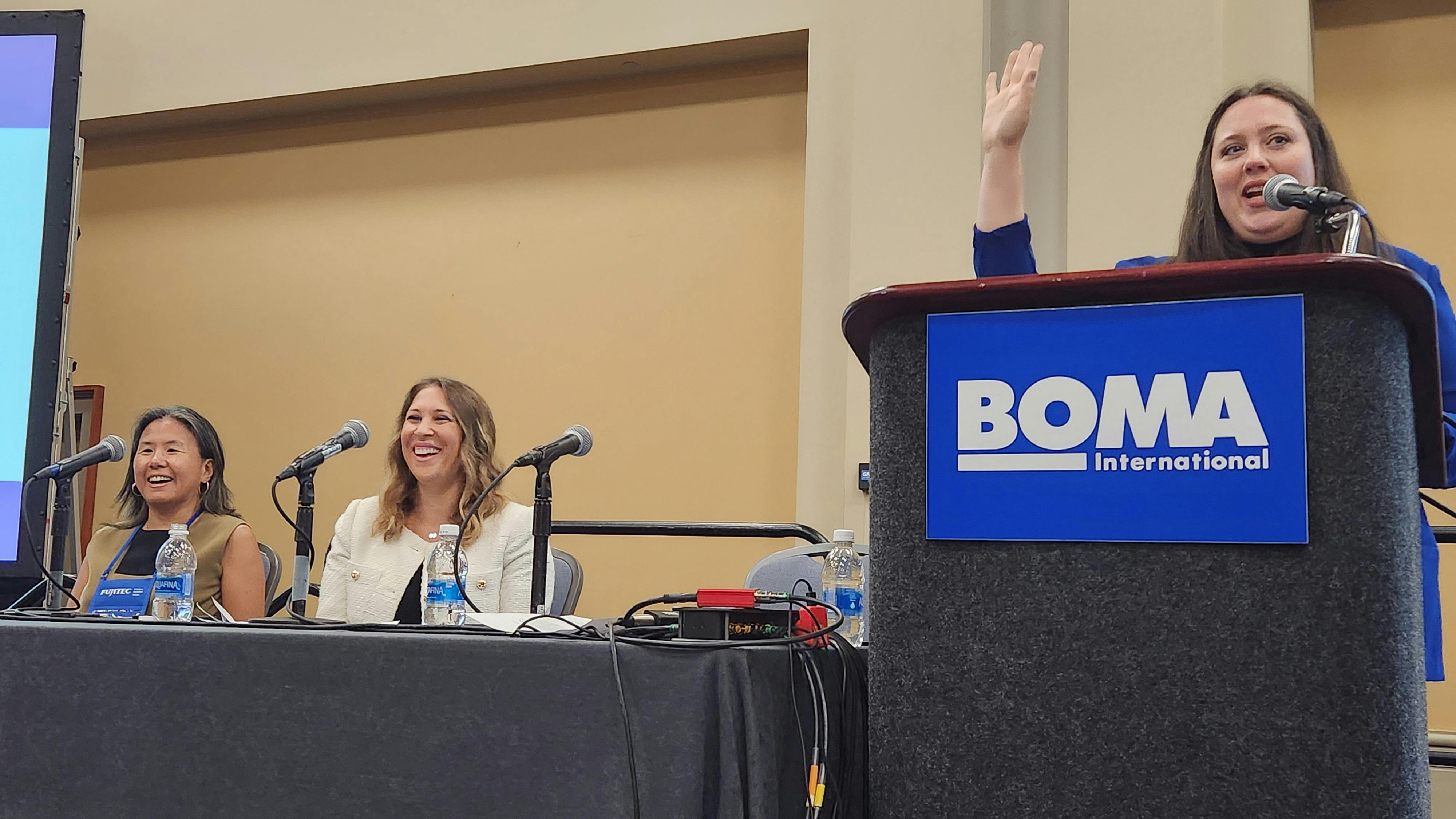 Hannah Debelius, Better Buildings program manager for the Department of Energy, leads a panel at the 2024 BOMA International Conference & Expo. Chun Yee Yip, vice president of social impact for Lendlease (left) and Michelle German, vice president of ESG for LBA Realty (center) discussed real-world strategies to decrease Scope 3 emissions.