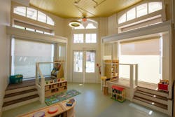 The original storefront windows for the Lemann Building have been transformed into play areas for the West Ascension Early Learning Center. The original storefront windows for the Lemann Building have been transformed into play areas for the West Ascension Early Learning Center.