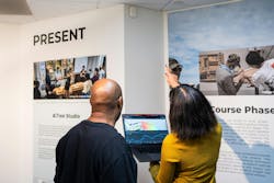 Wright Museum staff in a gallery pointing to a CO2 sensor that is feeding near real-time data into Autodesk Tandem Wright Museum staff in a gallery pointing to a CO2 sensor that is feeding near real-time data into Autodesk Tandem