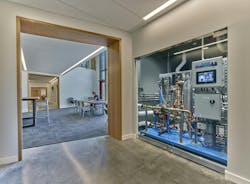 The rainwater harvesting system can capture up to 10,000 gallons of water in an on-site tank. Pictured here are the brains of the harvesting system; having it be so visible makes it easy to learn how rainwater harvesting works. The rainwater is held in the cistern, purified, and then used to flush toilets. The rainwater harvesting system can capture up to 10,000 gallons of water in an on-site tank. Pictured here are the brains of the harvesting system; having it be so visible makes it easy to learn how rainwater harvesting works. The rainwater is held in the cistern, purified, and then used to flush toilets.