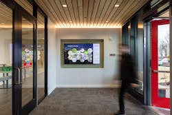 The entrance vestibule features an educational dashboard that reports real time statistics about the building’s energy and water use, as well as information about how the building achieved LEED Platinum and Core Living Building certification. The entrance vestibule features an educational dashboard that reports real time statistics about the building’s energy and water use, as well as information about how the building achieved LEED Platinum and Core Living Building certification.