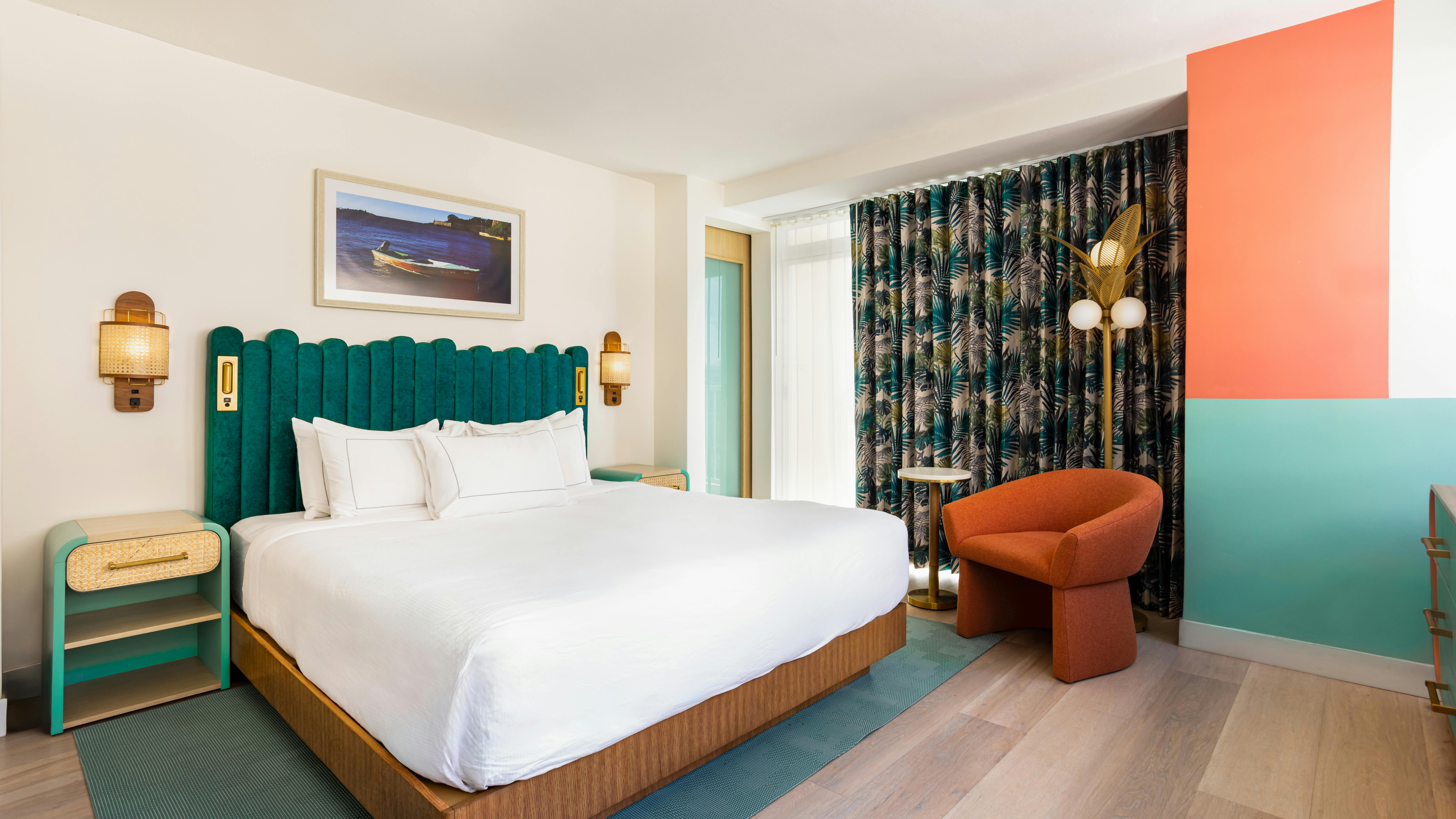 Colors, textures, and custom furnishings infuse the property&rsquo;s formerly nondescript spaces with island energy and culture. A color-blocked wall makes a great backdrop for bleisure travelers&rsquo; conference calls.