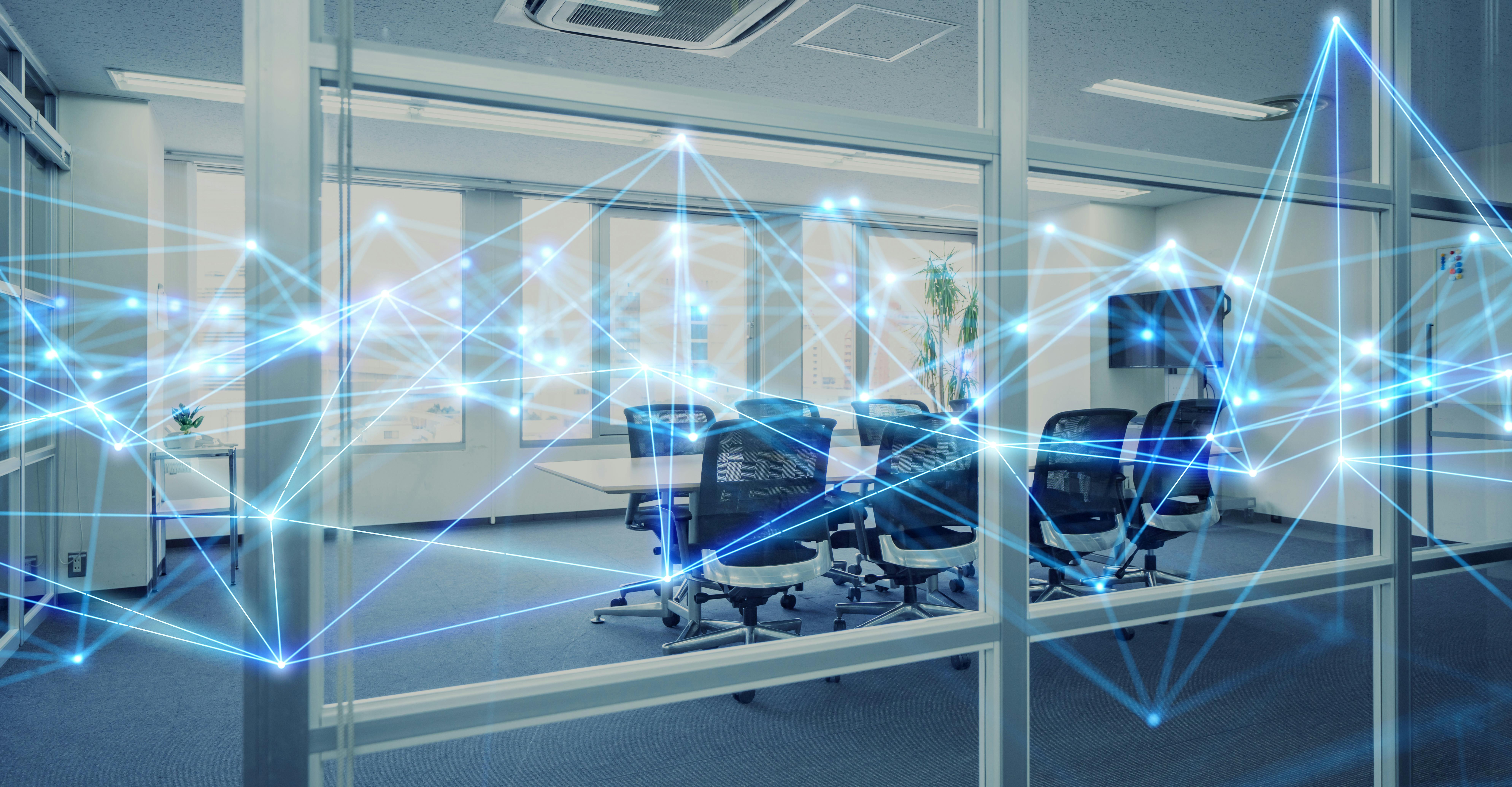 Conference room with connected geometric lines representing tech-connections.