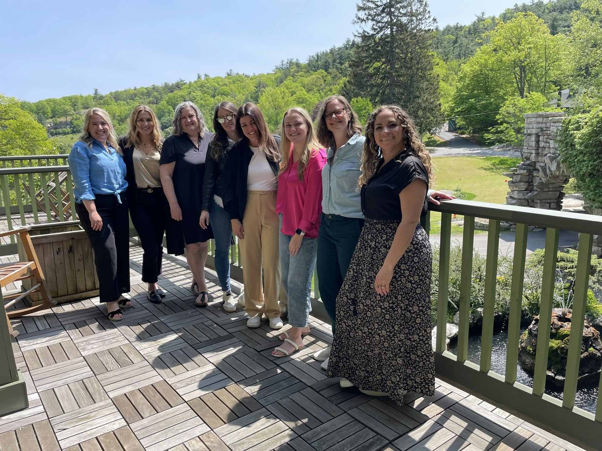 Yellow Goat Design&rsquo;s North American team, led by Carey Schuster (second from left) brings together craftspeople, artists, and designers to realize a harmonized yet unique vision for each client.