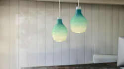Signify uses discarded nylon fish netting as filament in the 3D printing of its Coastal Breeze line of pendants.