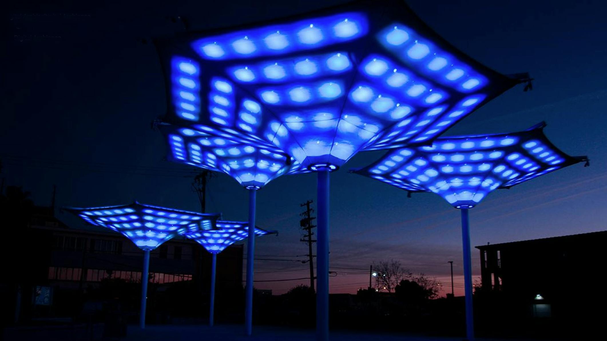 In a recent interview, Strategies in Light speaker Robb Pope, CEO of Digital Ambiance, explained that the practice of digital placemaking 'uses technology to create spectacle and identity around architecture.' One innovative example is this canopy installation at the Cultural Arts District Park in Fresno, CA, where motion tracking and interactive lighting controls change the light patterns produced. (Photo credit: Image courtesy of Digital Ambiance.)