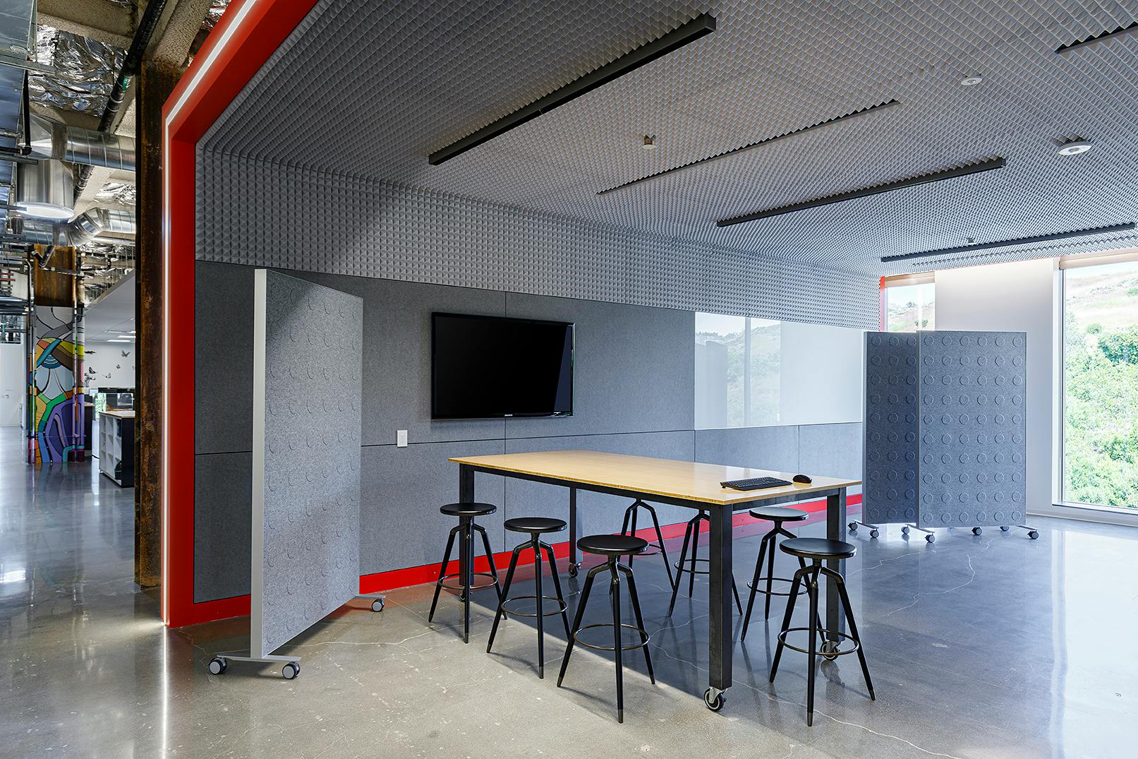 A-Light&rsquo;s Apex APX3 ceiling-mount LED luminaires provide ambient light in the Colab 3 space at architectural firm LPA Design Studios. Each APX3 comprises single cells combined to create a linear system. A baffle optic delivering a 55&deg; beam cutoff and uniform light distribution that blends seamlessly with natural light in the environment. (Photo credit: Image by Costea Photography, Inc.; courtesy of A-Light, an Acuity Brand.)